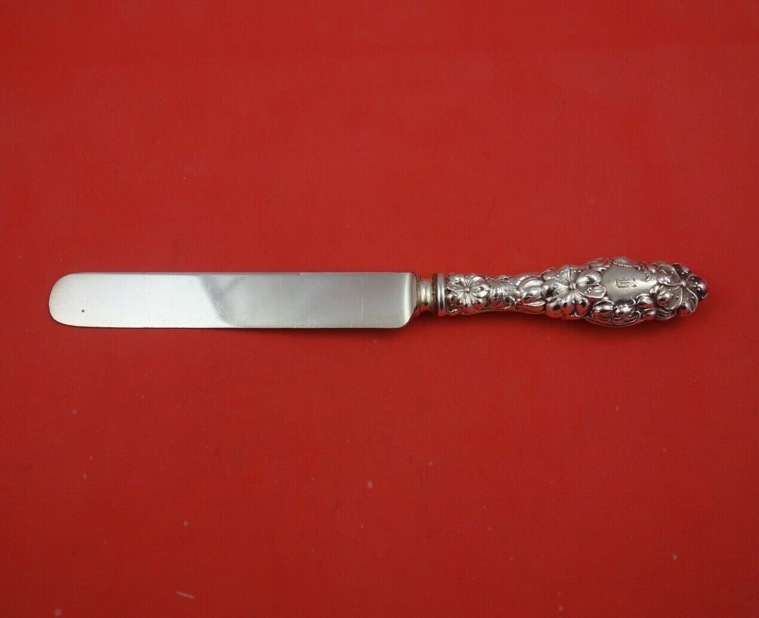 Dominick & Haff Blossom Sterling Silver Knife 9 3/8 Inch: Dominick & Haff Blossom Sterling Silver Knife 9 3/8 Inch This exquisite knife is part of the Blossom pattern by Dominick & Haff, crafted from high-quality sterling silver. The piece features a hollow