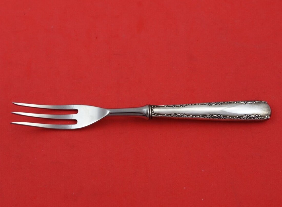 Gorham Camellia Sterling Silver 7 Inch Steak Fork 3-Tine: Gorham Camellia Sterling Silver 7 Inch Steak Fork 3-Tine Elevate your dining experience with this exquisite steak fork from the Camellia pattern by Gorham. Crafted from high-quality sterling silver (.