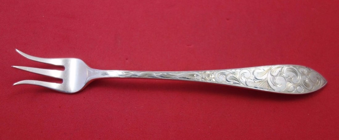 Schofield Lorraine Engraved Sterling Silver Cocktail Fork 5 3/4 in: Schofield Lorraine Engraved Sterling Silver Cocktail Fork 5 3/4 in This exquisite Sterling Silver cocktail fork, measuring 5 3/4 inches, showcases the elegant Lorraine all-over engraving by Schofield.