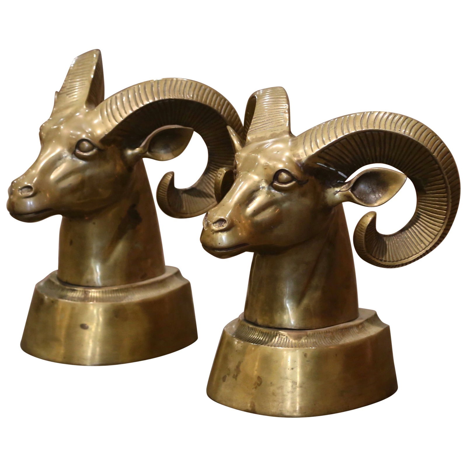 Vintage French Gilt Brass Ram Head Sculptures Set of 2: Vintage French Gilt Brass Ram Head Sculptures Set of 2 Enhance your decor with this elegant pair of vintage French gilt brass ram head sculptures. Each sculpture features a striking ram head design, b