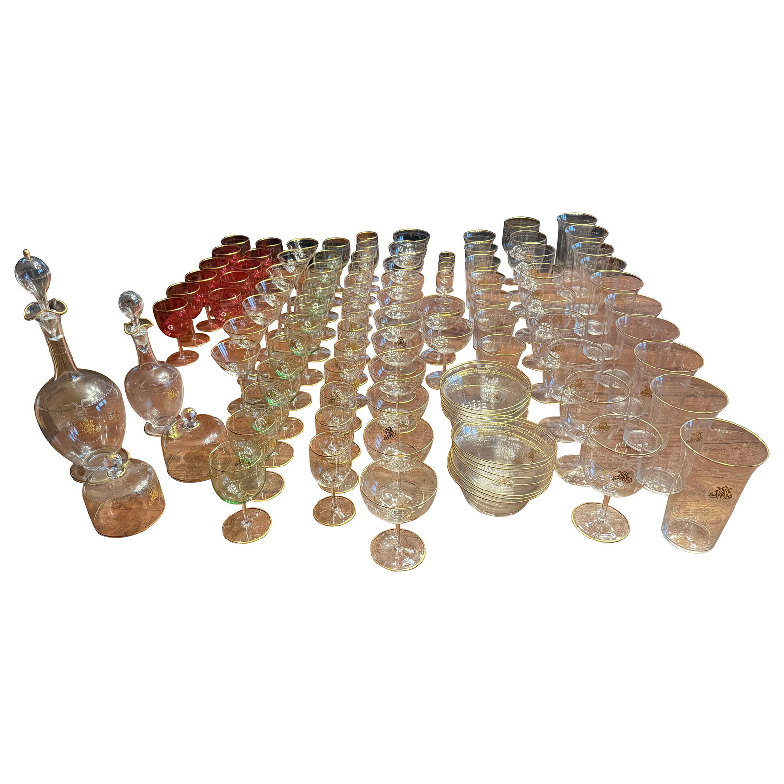 101 Piece Belle Epoque Gilt Monogrammed Glass Set France c 1900: 101 Piece Belle Epoque Gilt Monogrammed Glass Set France c 1900 This exquisite 101-piece glass service, inspired by the Belle Epoque style, showcases the elegance of turn-of-the-century craftsmanship