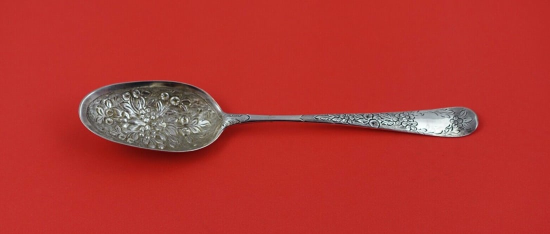Georgian Sterling Silver Serving Spoon Chased Floral Handle 8 1/8": Georgian Sterling Silver Serving Spoon Chased Floral Handle 8 1/8" This exquisite English Georgian serving spoon is crafted from sterling silver, showcasing a beautifully chased handle adorned with fl