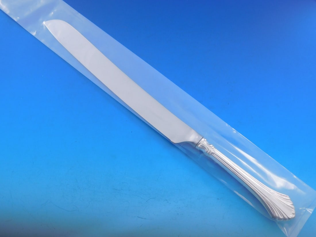 Wallace French Regency Sterling Silver Wedding Cake Knife 12 5/8 Custom Made: Wallace French Regency Sterling Silver Wedding Cake Knife 12 5/8 Custom Made This exquisite wedding cake knife features the elegant French Regency pattern by Wallace. Crafted from sterling silver with