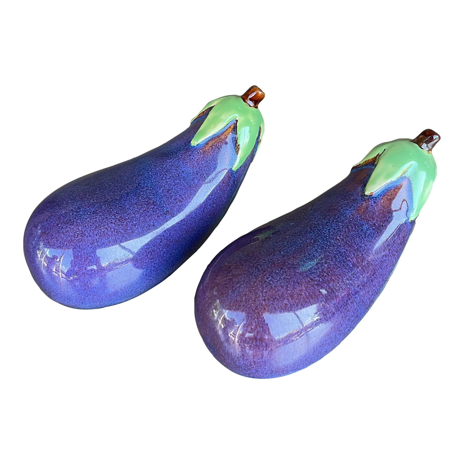 Whimsical Vintage Boho Ceramic Eggplants Pair from Palm Beach: Whimsical Vintage Boho Ceramic Eggplants Pair from Palm Beach Enhance your home decor with this charming pair of Vintage Boho Glazed Ceramic Eggplants. Each piece showcases artistic, playful glazes th