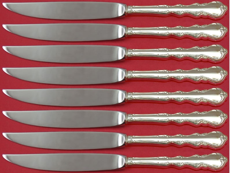 Angelique International Sterling Silver Steak Knife Set 8pc Hollow Handle: Angelique International Sterling Silver Steak Knife Set 8pc Hollow Handle Elevate your dining experience with the Angelique by International Sterling Silver Steak Knife Set. This exquisite 8-piece set