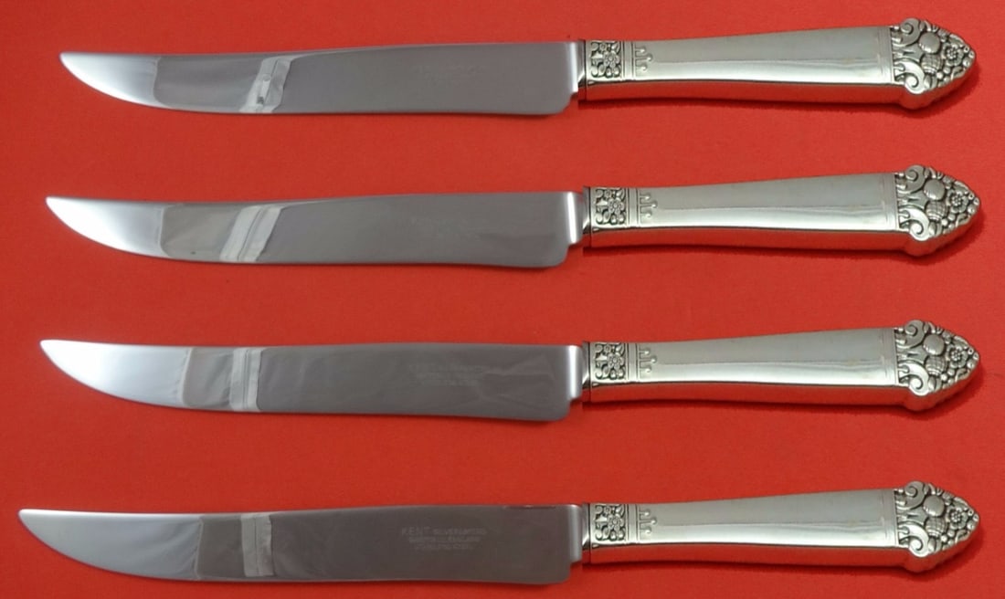 Oneida King Cedric Sterling Silver Steak Knife Set 4pc Texas Sized: Oneida King Cedric Sterling Silver Steak Knife Set 4pc Texas Sized Elevate your dining experience with the King Cedric Sterling Silver Steak Knife Set by Oneida. This impressive 4-piece set features a