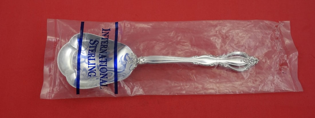 International Silver Grande Regency Sterling Silver Berry Spoon 8 3/4": International Silver Grande Regency Sterling Silver Berry Spoon 8 3/4" Elevate your dining experience with the Grande Regency Berry Spoon by International Silver. This exquisite serving spoon, crafted