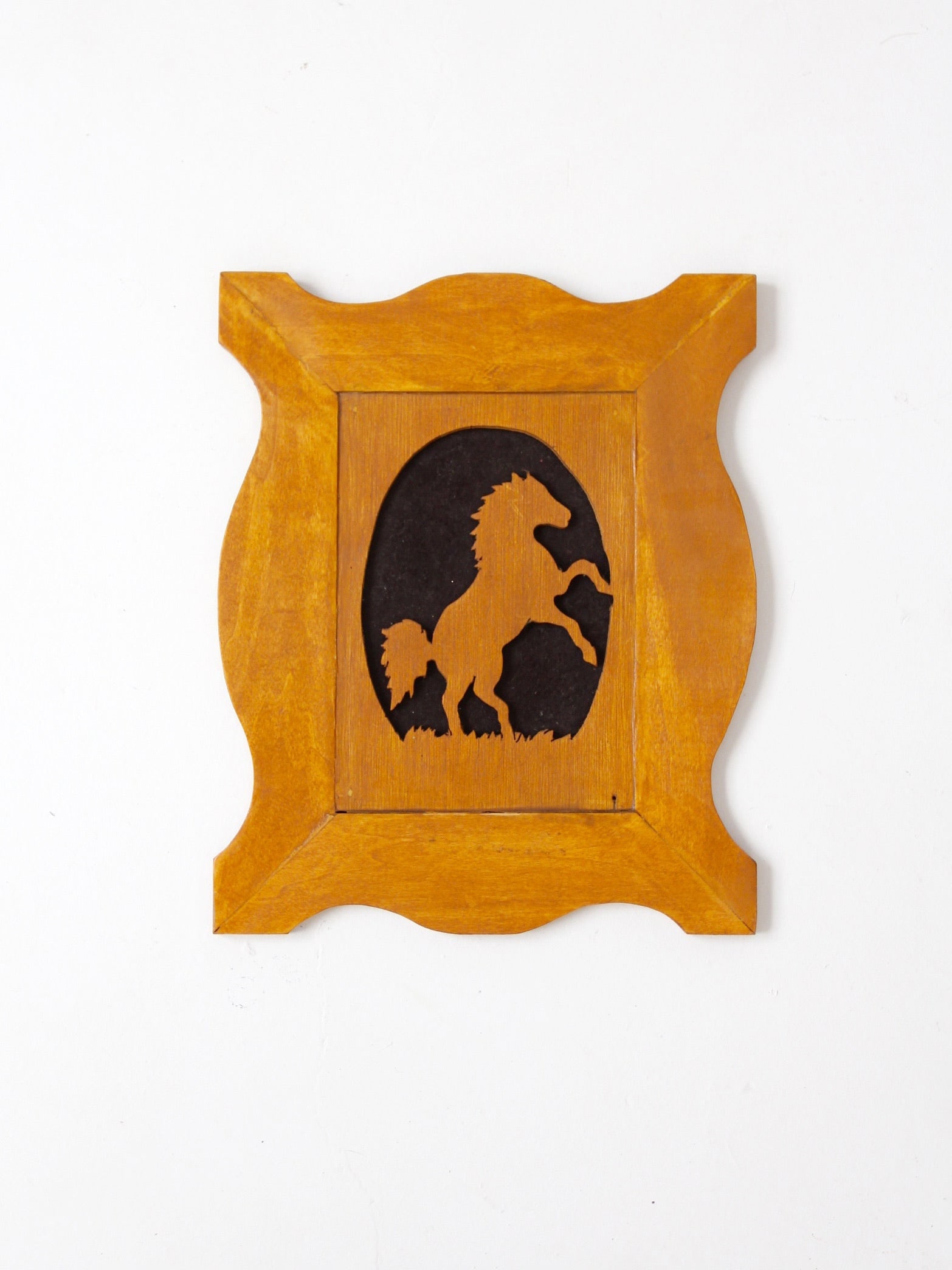 Oval Honey Wood Wall Plaque with Rearing Horse Silhouette: Oval Honey Wood Wall Plaque with Rearing Horse Silhouette This vintage wooden wall plaque features a rearing horse silhouette framed within an oval opening and surrounded by a sculptural shaped border