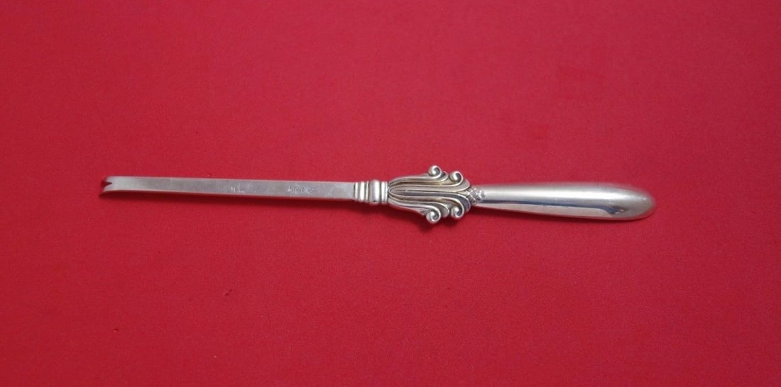 Georg Jensen Acanthus Sterling Silver Lobster Pick 7 3/8": Georg Jensen Acanthus Sterling Silver Lobster Pick 7 3/8" This exquisite Acanthus Lobster Pick, crafted by Georg Jensen, showcases a timeless design that dates back to 1900-1940. Made from high-qualit