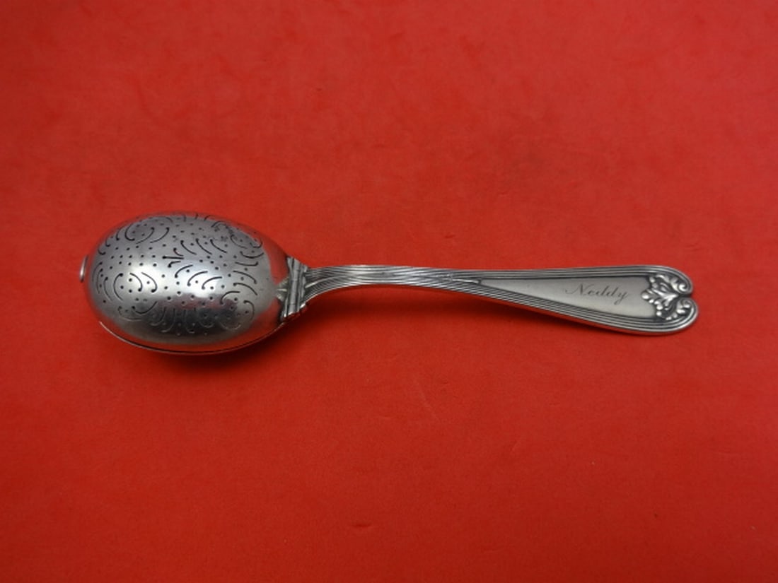 Tiffany & Co Colonial Sterling Silver Tea Infusion Spoon 5 3/4": Tiffany & Co Colonial Sterling Silver Tea Infusion Spoon 5 3/4" This exquisite tea infusion spoon is a stunning example of the Colonial pattern by Tiffany & Co., crafted from high-quality sterling sil