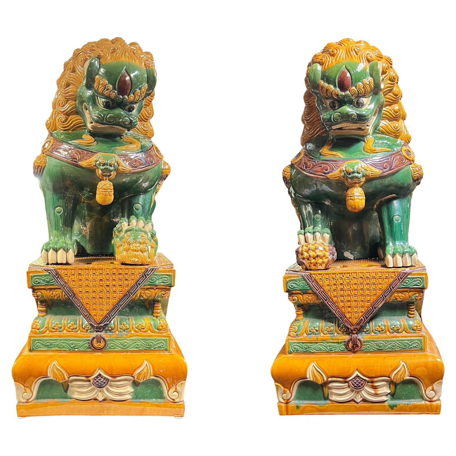 Chinese Polychrome Glazed Terracotta Guardian Lion Pair 20th Century: Chinese Polychrome Glazed Terracotta Guardian Lion Pair 20th Century This pair of monumental Chinese guardian lions is crafted from polychrome glazed terracotta. Dating from the 20th century, circa 19