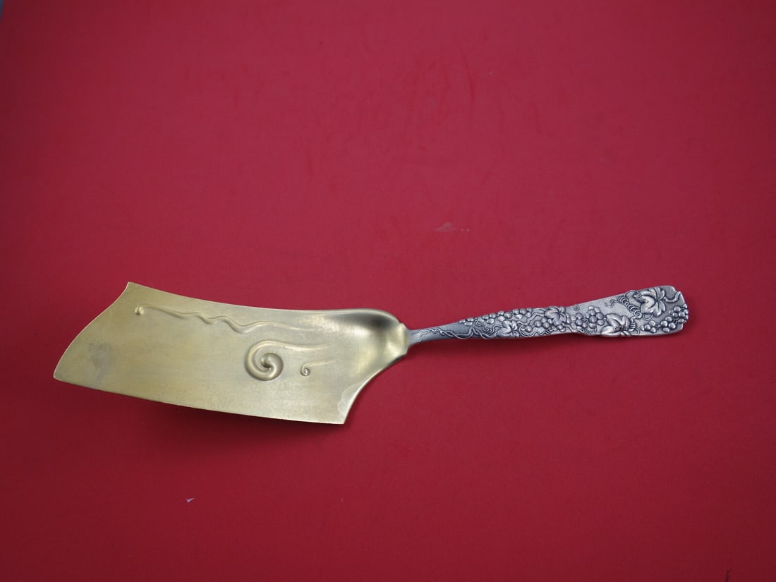 Tiffany & Co. Vine Sterling Silver Ice Cream Hatchet 12 Inch Grapevine Motif: Tiffany & Co. Vine Sterling Silver Ice Cream Hatchet 12 Inch Grapevine Motif Discover the exquisite Vine by Tiffany Sterling Silver Ice Cream Hatchet, a remarkable addition to any silverware collectio