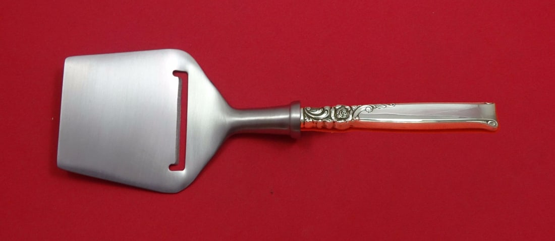 Oneida Silver Rose Sterling Silver Cheese Plane Custom 8.25 Inch: Oneida Silver Rose Sterling Silver Cheese Plane Custom 8.25 Inch This exquisite cheese plane features a flat cutting blade crafted from high-quality stainless steel, complemented by a sterling silver