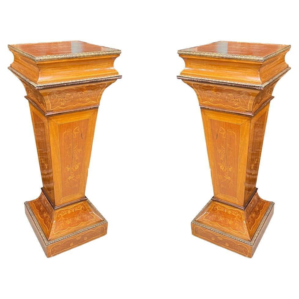 Set of Two Belle Epoque Fruitwood Pedestals with Gilt Bronze Inlay France 19th Century: Set of Two Belle Epoque Fruitwood Pedestals with Gilt Bronze Inlay France 19th Century This beautiful pair of late 19th-century French pedestals is crafted from fruitwood and features intricate marque