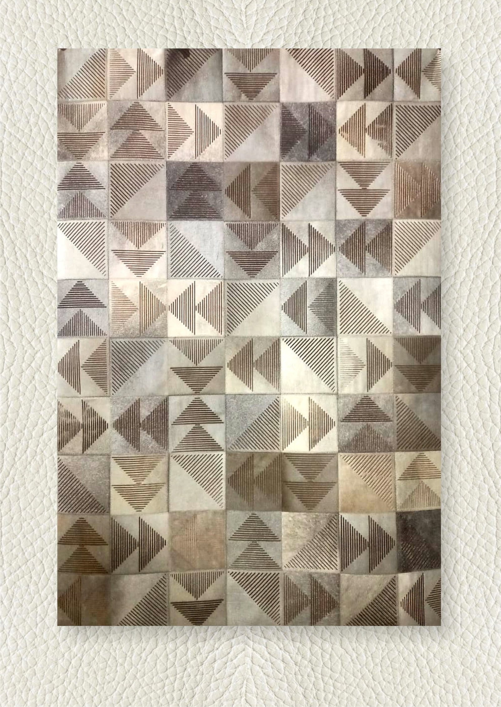 Hand Stitched Geometric Patchwork Cowhide Leather Rug 3FT x 5FT: Hand Stitched Geometric Patchwork Cowhide Leather Rug 3FT x 5FT Free continental US Shipping This contemporary area rug is expertly handcrafted from premium cowhide leather, featuring a hand-stitched