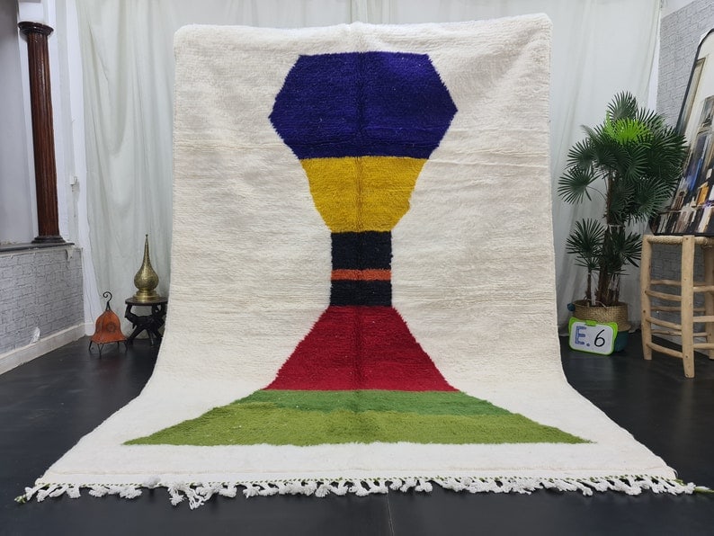 Handmade Moroccan Berber Wool Area Rug 9.84 x 6.56 feet: Handmade Moroccan Berber Wool Area Rug 9.84 x 6.56 feet Indulge in the luxury of this handmade Moroccan Berber wool area rug, exquisitely crafted by local women weavers in the Atlas Mountains. Utilizi