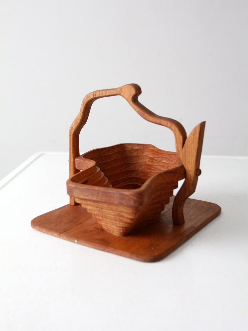 Vintage Wooden Collapsible Basket Honey Tone Design: Vintage Wooden Collapsible Basket Honey Tone Design This vintage collapsible wooden basket showcases a warm honey tone and an elegant folding design that beautifully merges aesthetic appeal with funct