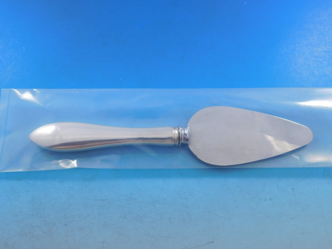 Dominick & Haff Pointed Antique Sterling Silver Cheese Server 6": Dominick & Haff Pointed Antique Sterling Silver Cheese Server 6" This exquisite cheese server from Dominick & Haff showcases the elegant Pointed Antique pattern. Crafted from high-quality sterling sil