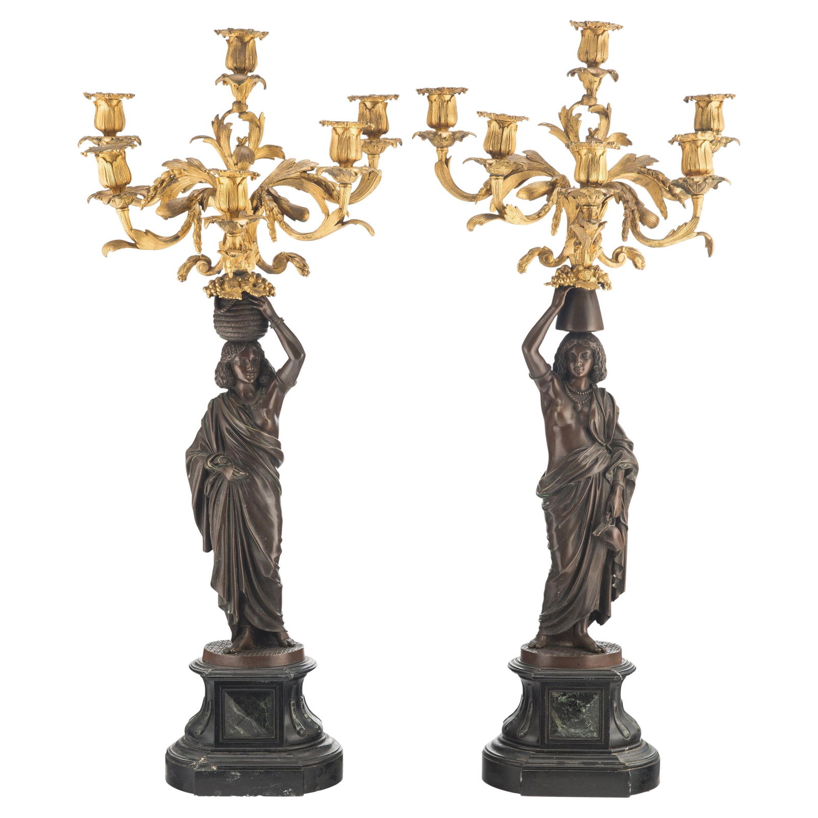 Set of Two French Neoclassical Bronze Figural Candelabras with Marble Bases: Set of Two French Neoclassical Bronze Figural Candelabras with Marble Bases This pair of large French 19th century figural candelabras features an exotic orientalist motif, crafted in gilt and patinat