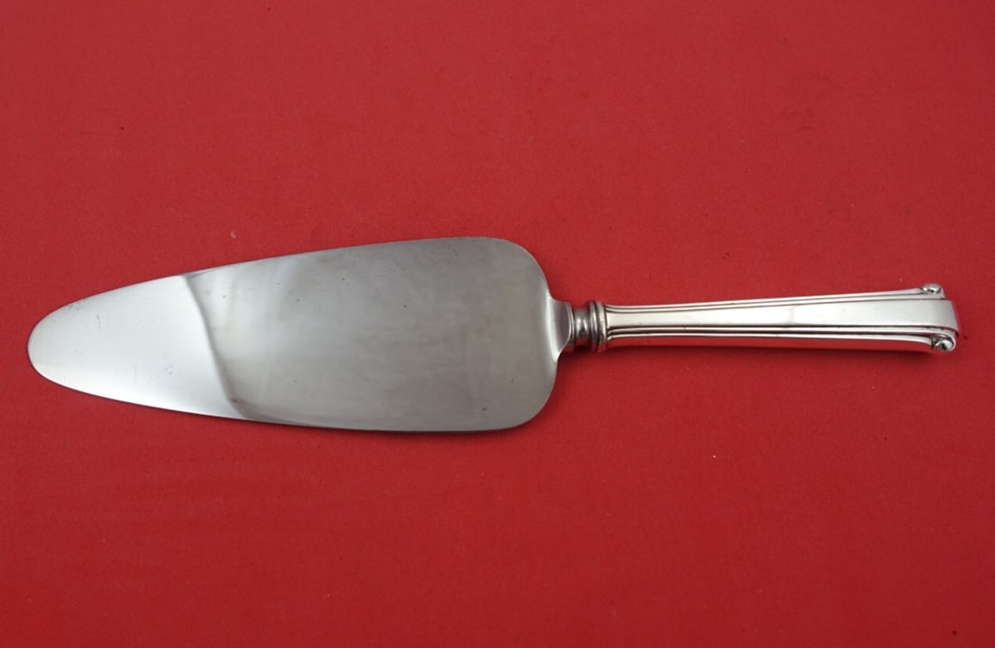 Reed and Barton Cotillion Sterling Silver Cake Server 10 Inch: Reed and Barton Cotillion Sterling Silver Cake Server 10 Inch This elegant cake server is from the Cotillion pattern by Reed and Barton, crafted in sterling silver. It features a hollow handle and a d