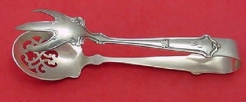 Saxon by Wallace Sterling Silver Ice Tong 7 Inch Serving Piece: Saxon by Wallace Sterling Silver Ice Tong 7 Inch Serving Piece Introducing the Saxon by Wallace Sterling Silver Ice Tong, featuring both a pierced spoon and claw design, measuring 7 inches in length.