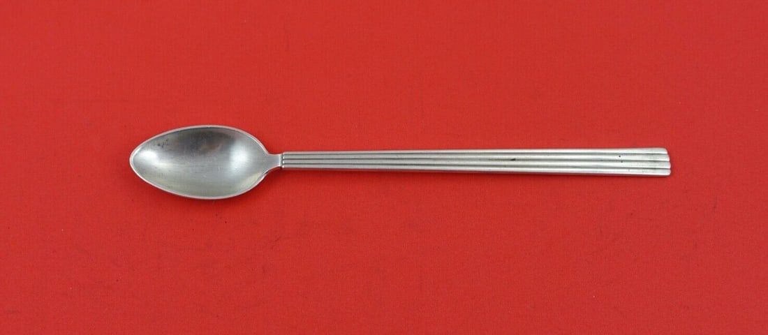 Georg Jensen Bernadotte Sterling Silver Iced Tea Spoon 7 3/8": Georg Jensen Bernadotte Sterling Silver Iced Tea Spoon 7 3/8" This exquisite iced tea spoon from the Bernadotte pattern by Georg Jensen is crafted from high-quality sterling silver. Measuring 7 3/8 in
