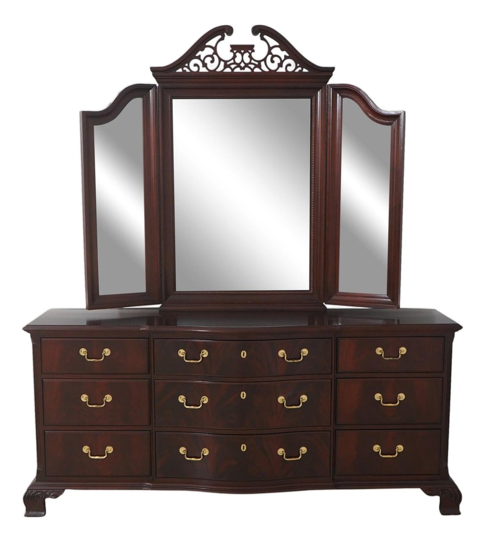 Mahogany Dresser with Trifold Mirror Chippendale Inspired by Thomasville: Mahogany Dresser with Trifold Mirror Chippendale Inspired by Thomasville This Thomasville dresser features a classic Chippendale style, crafted from high-quality figural mahogany with a dark reddish f