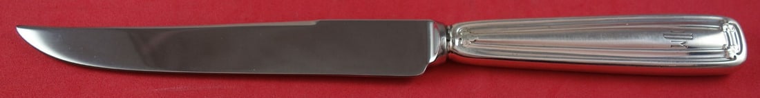 Tiffany & Co. Saint Dunstan Sterling Silver Steak Knife 9": Tiffany & Co. Saint Dunstan Sterling Silver Steak Knife 9" This exquisite steak knife is crafted from sterling silver and features the elegant Saint Dunstan pattern by Tiffany & Co. Measuring 9 inches