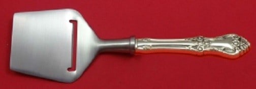 Oneida Afterglow Sterling Silver Cheese Plane 8 1/4 Custom Handle: Oneida Afterglow Sterling Silver Cheese Plane 8 1/4 Custom Handle Experience elegance with the Afterglow Cheese Plane by Oneida. This beautifully crafted cheese plane features a custom-made hollow han