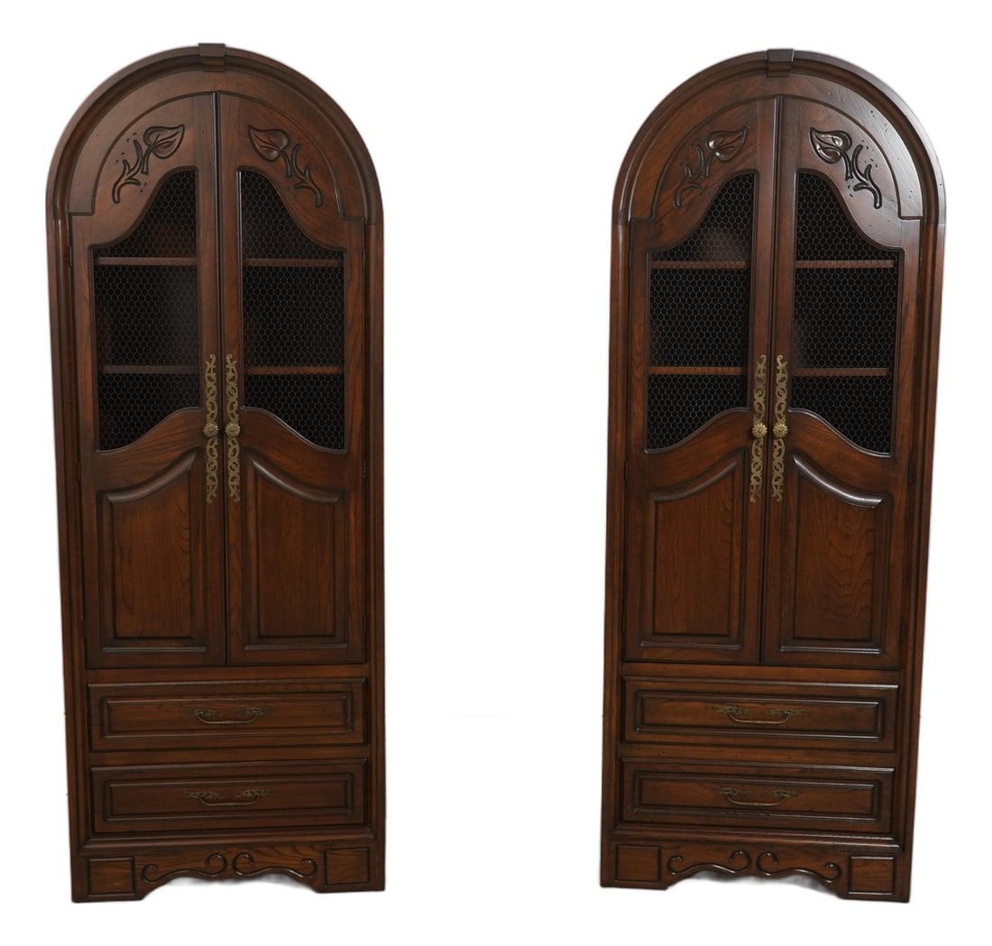 Set of 2 Oak Dome Top Curio Display Cabinets with Brass Hardware: Set of 2 Oak Dome Top Curio Display Cabinets with Brass Hardware This pair of tall dome top curio cabinets features factory distressed oak construction in a Country French style. Each cabinet includes