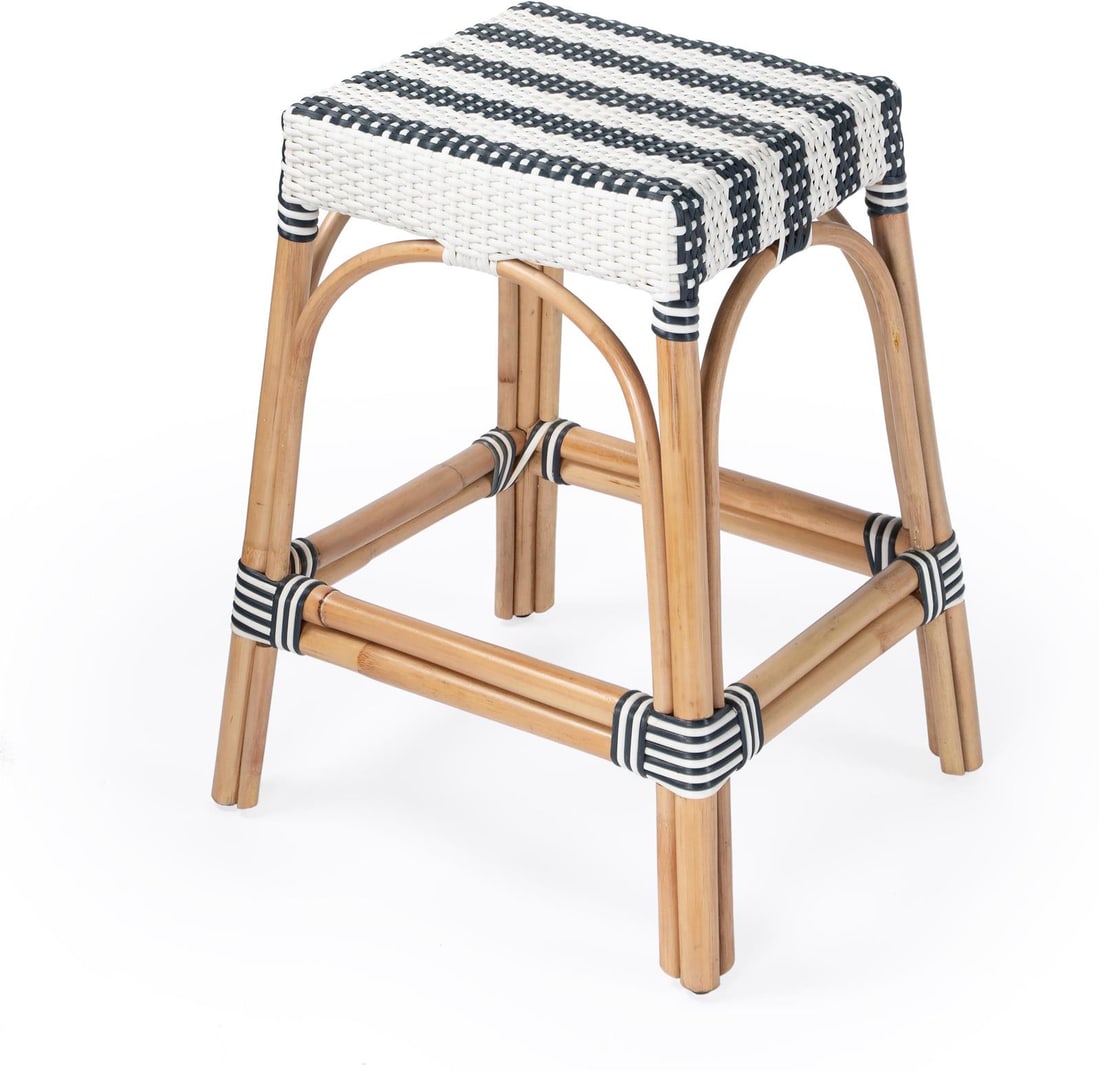 Butler Coastal Style Rattan Stool Natural Finish 24.5H: Butler Coastal Style Rattan Stool Natural Finish 24.5H This Coastal Style Rattan Stool brings a touch of elegance and a relaxed vibe to your interiors. With a natural rattan frame complemented by a bl