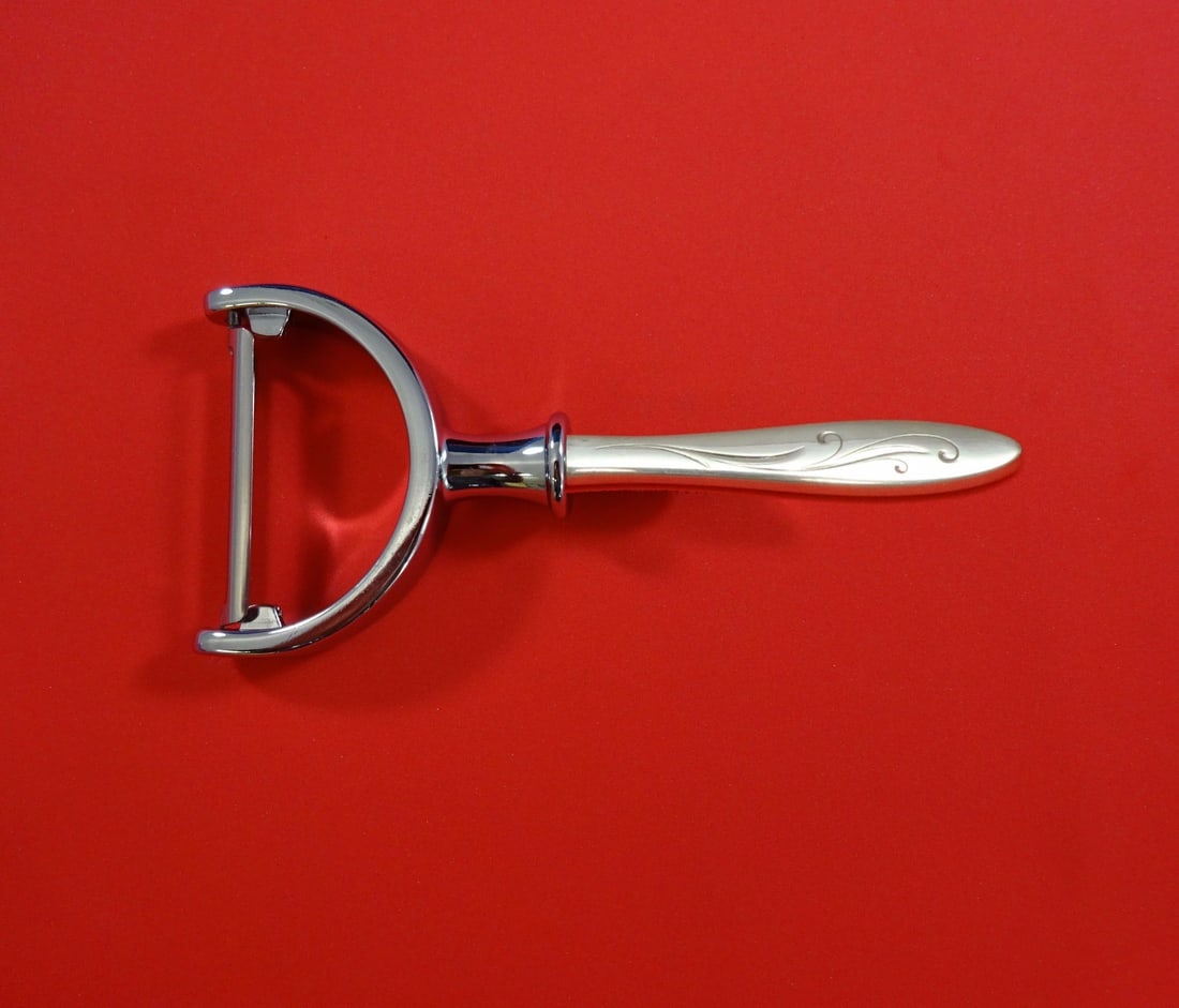 Towle Awakening Sterling Silver Vegetable Peeler Custom Made 6": Towle Awakening Sterling Silver Vegetable Peeler Custom Made 6" Introducing the Awakening Vegetable Peeler by Towle, a beautifully crafted kitchen tool made from sterling silver. This custom-made peel
