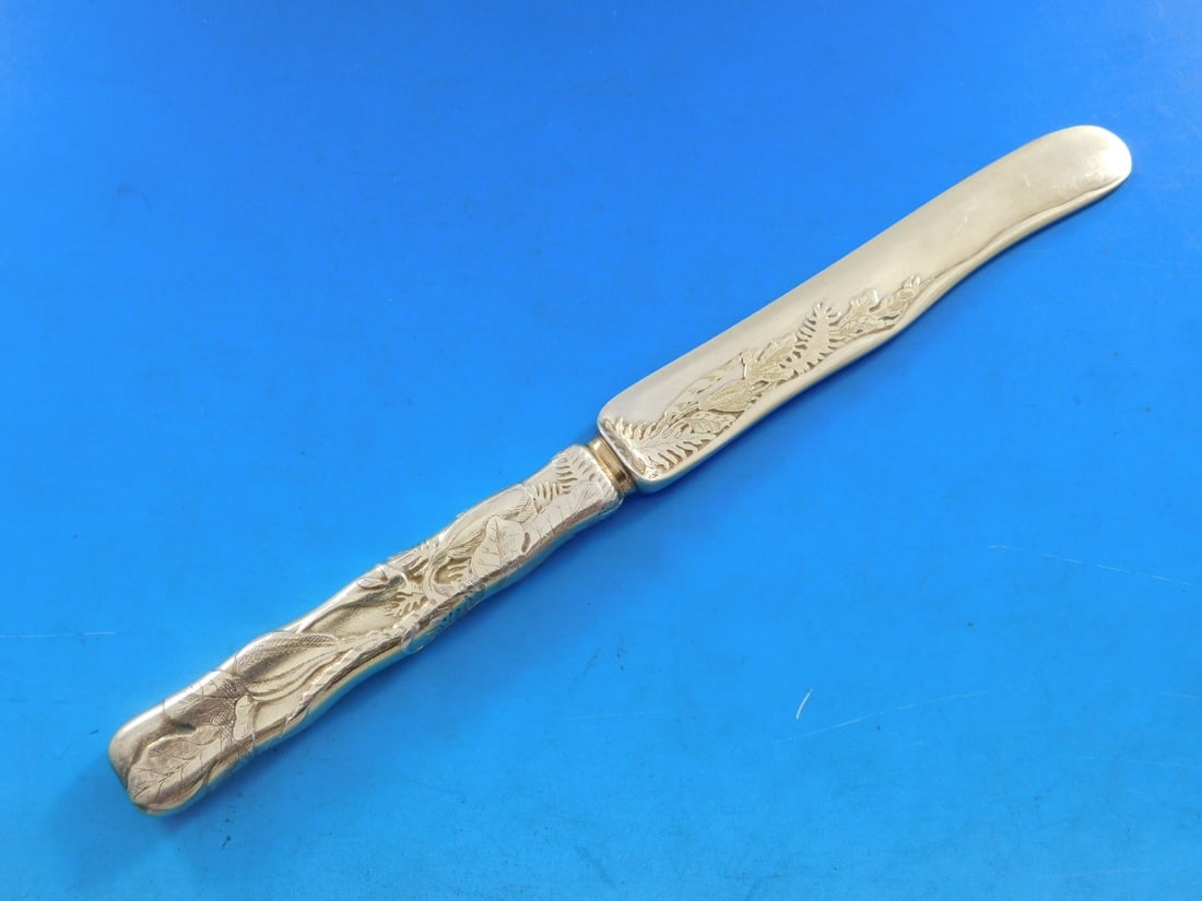 Tiffany & Co Lap Over Edge Sterling Silver Vermeil Dessert Knife 7 3/8" Fruit Motif: Tiffany & Co Lap Over Edge Sterling Silver Vermeil Dessert Knife 7 3/8" Fruit Motif This exquisite dessert knife from Tiffany & Co. features the elegant Lap Over Edge pattern and is crafted from sterl