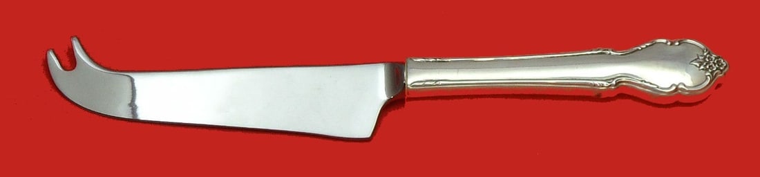 International Sterling Silver Cheese Knife Breton Rose Pattern 7.5 Inch: International Sterling Silver Cheese Knife Breton Rose Pattern 7.5 Inch This exquisite cheese knife features the charming Breton Rose pattern by International Sterling. Crafted from high-quality sterl
