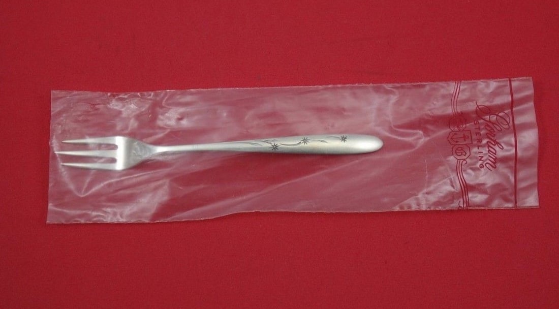 Gorham Celeste Sterling Silver Cocktail Fork 5 7/8 Inch New: Gorham Celeste Sterling Silver Cocktail Fork 5 7/8 Inch New This elegant Celeste cocktail fork by Gorham is crafted from high-quality sterling silver, measuring 5 7/8 inches in length. The fork featur