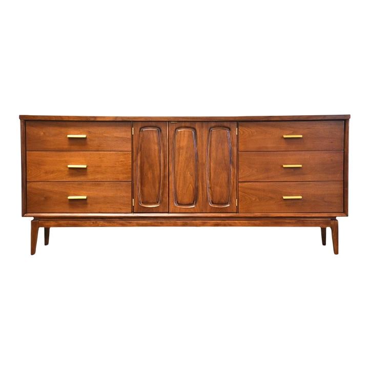 Mid Century Modern Walnut Dresser with Brass Hardware 72.25": Mid Century Modern Walnut Dresser with Brass Hardware 72.25" This mid-century modern long dresser showcases a beautiful walnut finish complemented by polished brass hardware. Professionally refinished