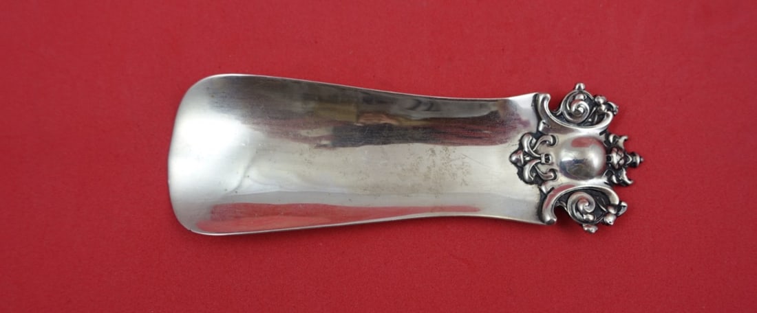 Sterling Silver Shoe Horn with Japonesque Handle by Shiebler 4.5 Inch: Sterling Silver Shoe Horn with Japonesque Handle by Shiebler 4.5 Inch This sterling silver shoe horn by Shiebler features a Japonesque-style handle. The piece measures 4 1/2 inches in length and is no