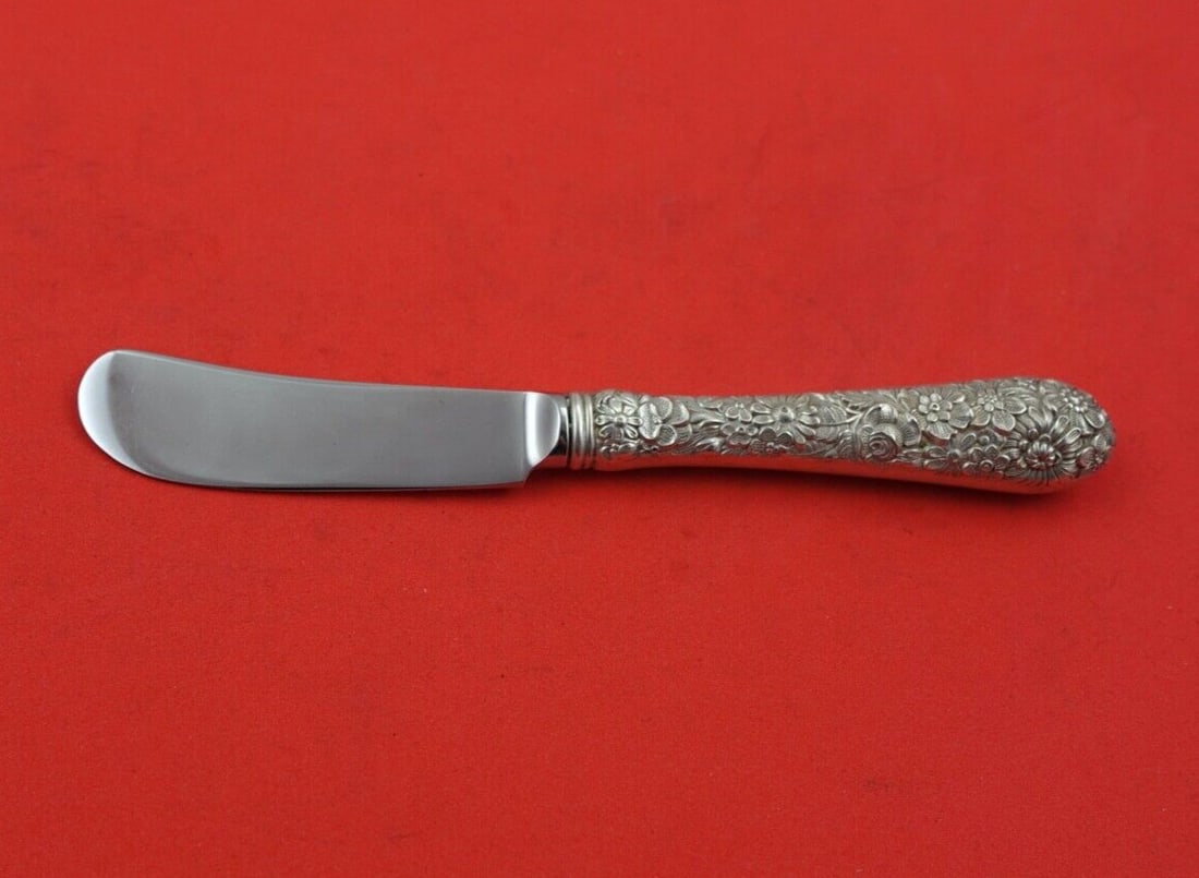 Alvin Bridal Bouquet Sterling Silver Butter Spreader 6 1/8": Alvin Bridal Bouquet Sterling Silver Butter Spreader 6 1/8" This exquisite butter spreader features the elegant Bridal Bouquet pattern by Alvin. Crafted from sterling silver, it showcases a hollow han