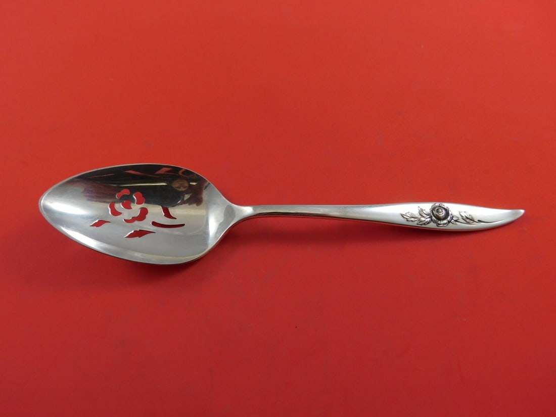 Oneida Belle Rose Sterling Silver Slotted Serving Spoon 8 1/4": Oneida Belle Rose Sterling Silver Slotted Serving Spoon 8 1/4" This exquisite Belle Rose serving spoon by Oneida is crafted from high-quality sterling silver. Featuring a slotted design adorned with a