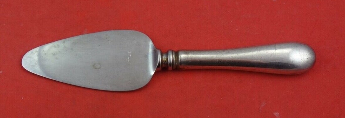 Tuttle Hannah Hull Sterling Silver Cheese Server 6 1/8": Tuttle Hannah Hull Sterling Silver Cheese Server 6 1/8" This exquisite cheese server features the elegant Hannah Hull pattern by Tuttle, crafted from high-quality sterling silver. The server is design