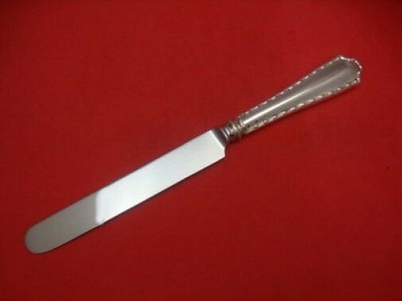 Tiffany & Co Marquise Sterling Silver Dinner Knife 10 1/4" Blunt Blade: Tiffany & Co Marquise Sterling Silver Dinner Knife 10 1/4" Blunt Blade Elevate your dining experience with this exquisite Marquise dinner knife by Tiffany & Co. Crafted between 1900 and 1940, this pie