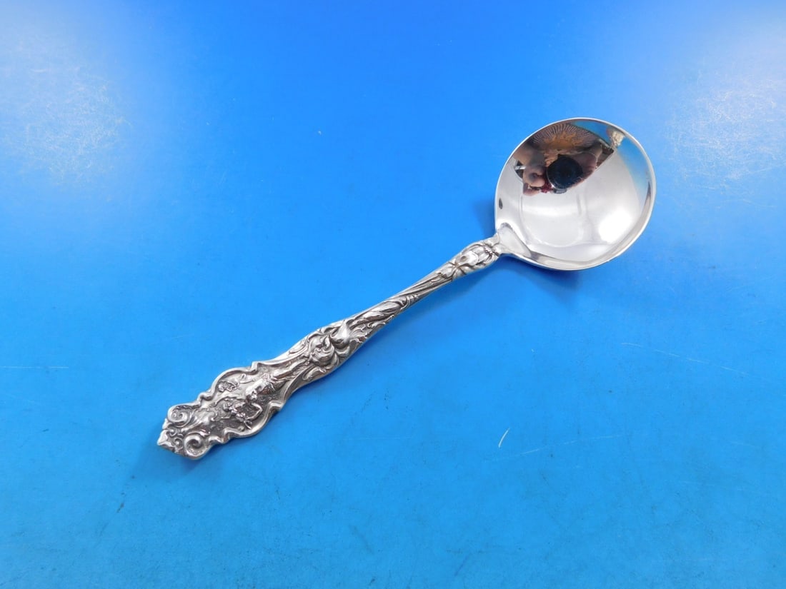 Wallace Irian Sterling Silver Bouillon Soup Spoon Art Nouveau 5 1/8": Wallace Irian Sterling Silver Bouillon Soup Spoon Art Nouveau 5 1/8" This exquisite Irian bouillon soup spoon from Wallace is a distinguished piece of heirloom silverware, crafted from high-quality st