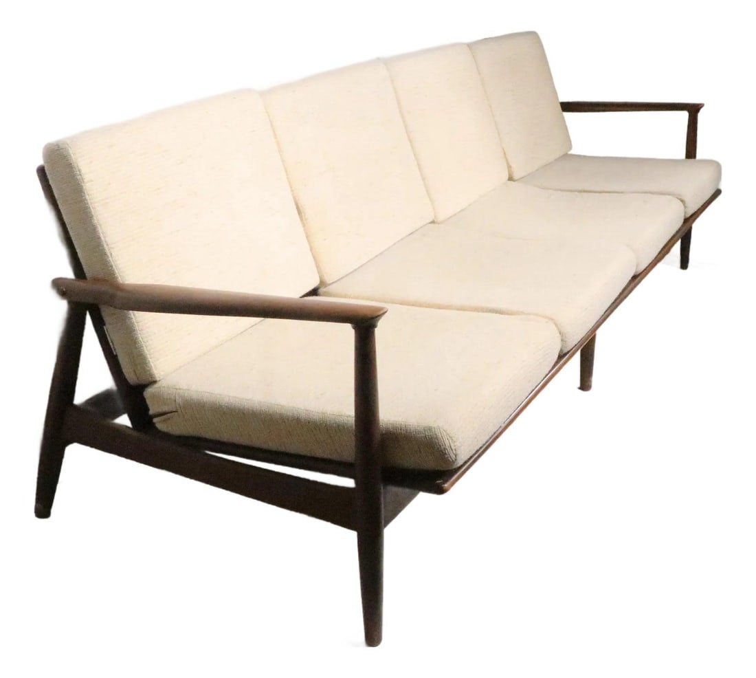 Four Seat Walnut Frame Sofa in Danish Modern Mid Century Style: Four Seat Walnut Frame Sofa in Danish Modern Mid Century Style This large Mid Century Danish Modern style sofa features a solid walnut frame and original foam seat cushions, complemented by brand new