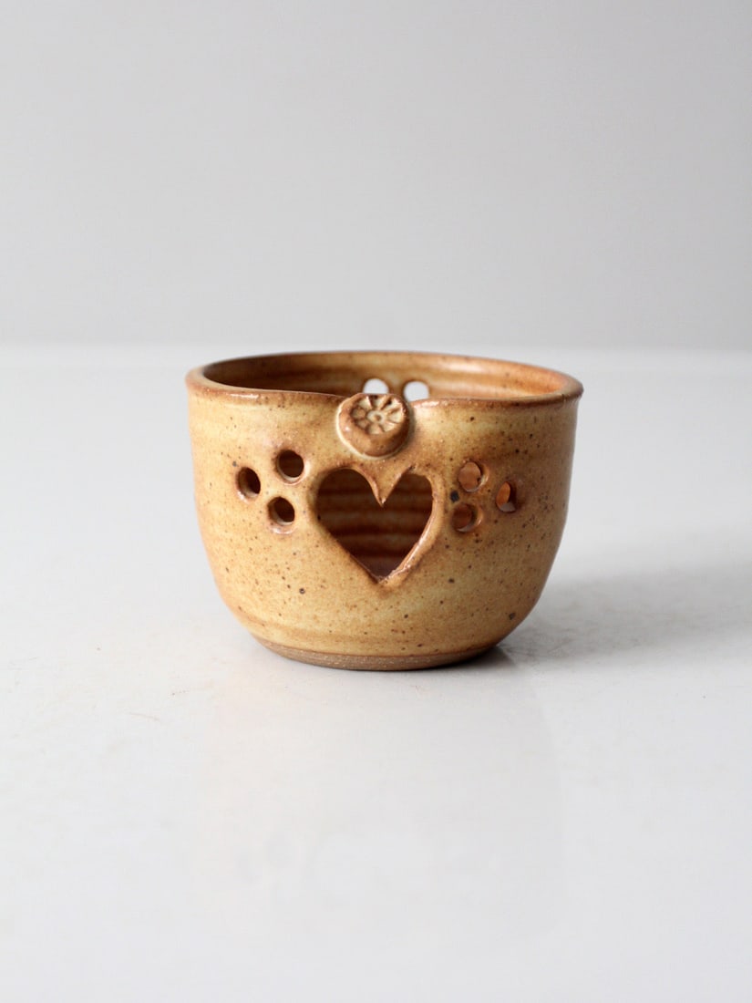 Handmade Tan Glazed Heart Cutout Studio Pottery Votive Holder: Handmade Tan Glazed Heart Cutout Studio Pottery Votive Holder This vintage handmade studio pottery votive candle holder features a warm tan glaze with subtle surface variation and a pierced heart deta