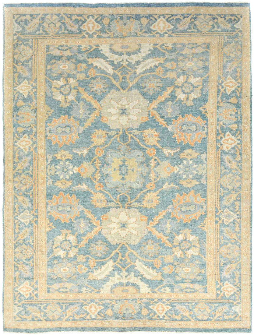 9x12 Wool Blue Floral Oushak Chobi Hand-Knotted Area Rug: 9x12 Wool Blue Floral Oushak Chobi Hand-Knotted Area Rug This hand-knotted blue Oushak Chobi rug features a floral pattern in muted tones of blue, orange, cream, and beige, offering a modern, transiti