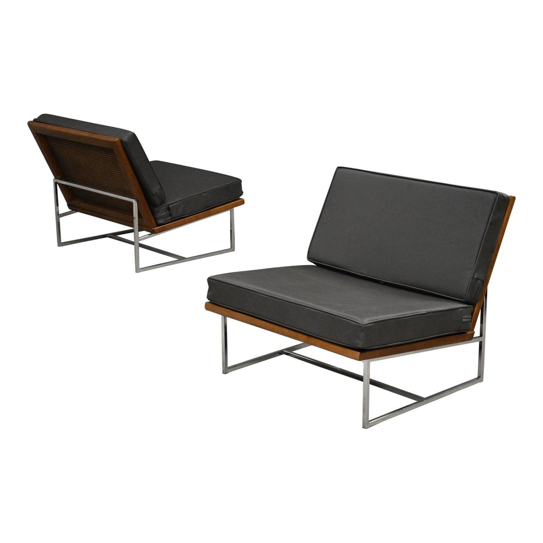 Pair of Mid Century Ash Lounge Chairs With Grey Beige Leather and Cane Backs: Pair of Mid Century Ash Lounge Chairs With Grey Beige Leather and Cane Backs This pair of mid-century modern lounge chairs features solid ash frames with a rich walnut color stain, complemented by can