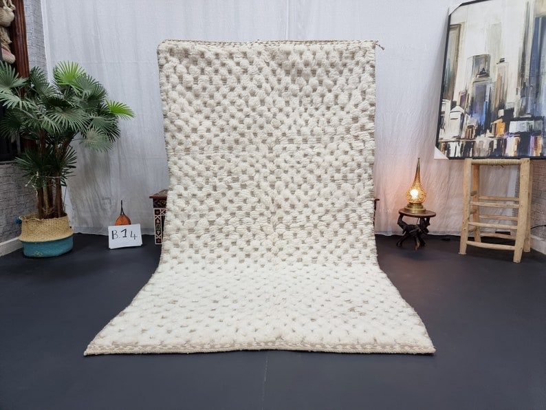 Handmade Moroccan Berber Wool Area Rug 10 x 5 feet: Handmade Moroccan Berber Wool Area Rug 10 x 5 feet Enhance your space with this Fabulous Soft White Engraved Handmade Moroccan Berber Wool Area Rug. Expertly handwoven in the Atlas Mountains by skille