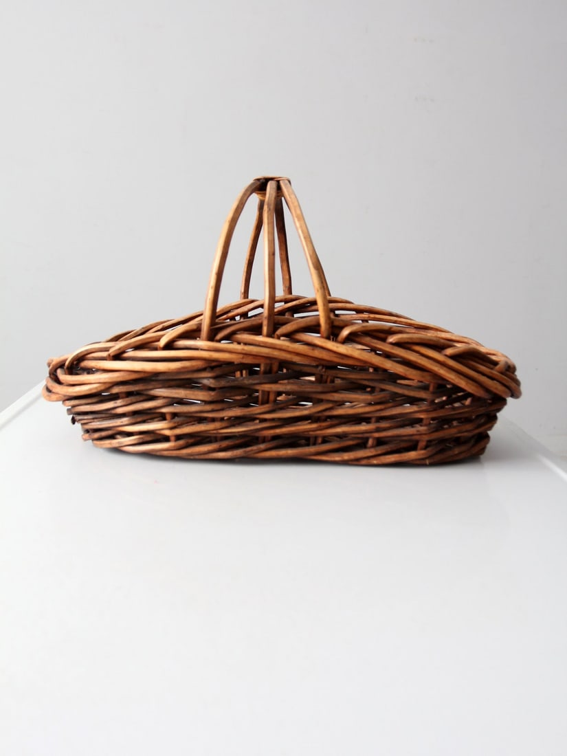 Vintage Rattan Gathering Basket with Center Handle 20 x 10 x 10.5 Inch: Vintage Rattan Gathering Basket with Center Handle 20 x 10 x 10.5 Inch This vintage rattan gathering basket features a sturdy woven construction and a convenient center handle for easy carrying. Its n