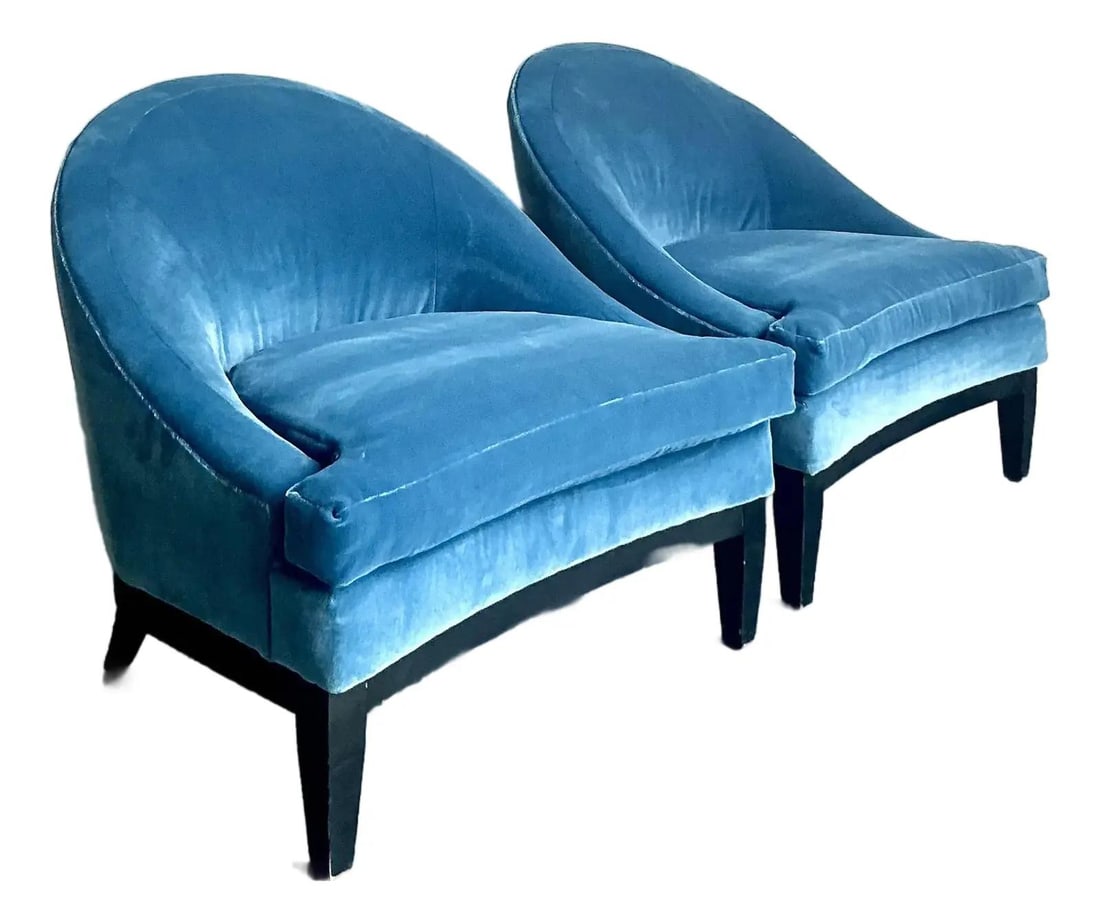 Pair of Velvet Barrel Back Lounge Chairs with Tapered Wood Legs: Pair of Velvet Barrel Back Lounge Chairs with Tapered Wood Legs This pair of vintage barrel back lounge chairs features plush slate-blue velvet upholstery and a seamless, curved silhouette for sophist