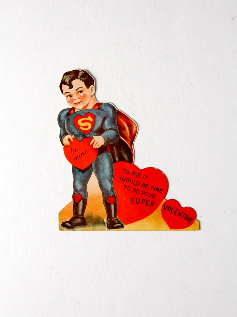 Vintage 1940s Superman Valentine Card Made in USA: Vintage 1940s Superman Valentine Card Made in USA Celebrate love with this charming Vintage Superman Valentine's Day card from the 1940s to 1950s. The card features a young Superman adorned with heart